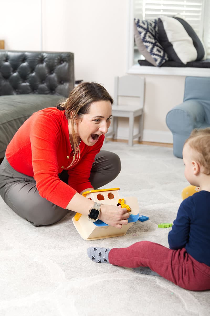 Margaryta Kuzmin playing with a toddler during an early intervention session